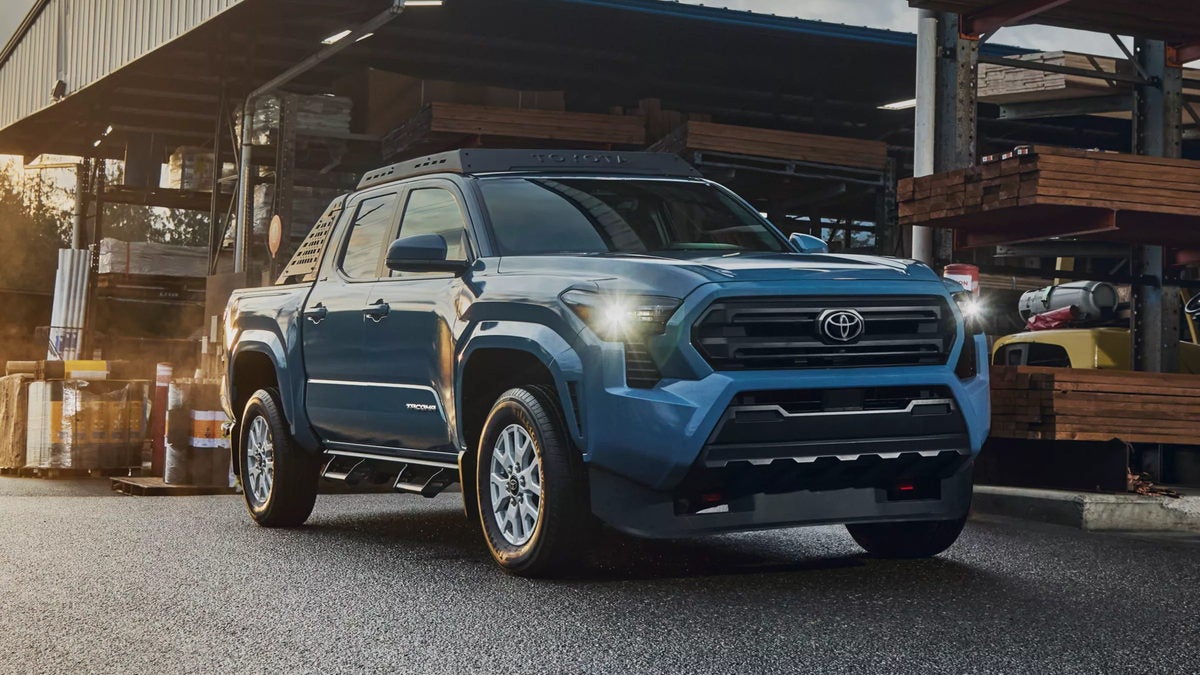 2026 Toyota Tacoma at a lumber yard, front three-quarter view